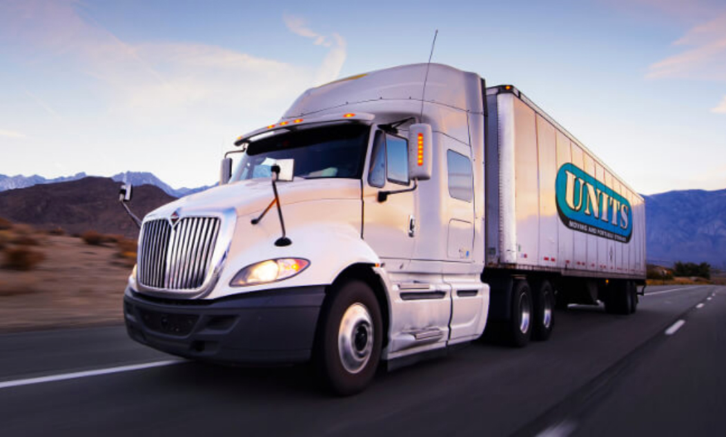 UNITS Moving and Portable Storage truck on an empty road.