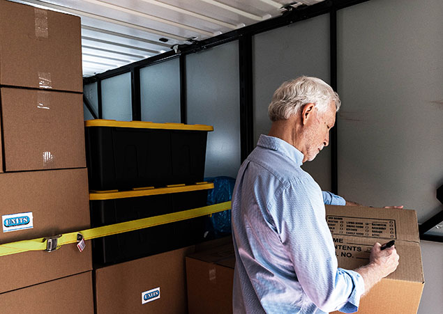 Man marking his belongings in a UNITS Portable Storage container in Baltimore Maryland