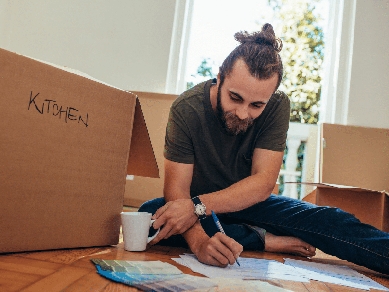 A man looking at his Packing Checklist