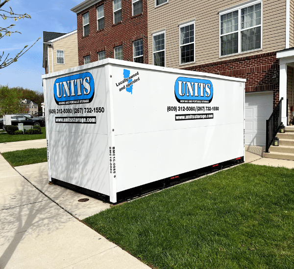 UNITS portable storage container parked in a driveway to help with a move.