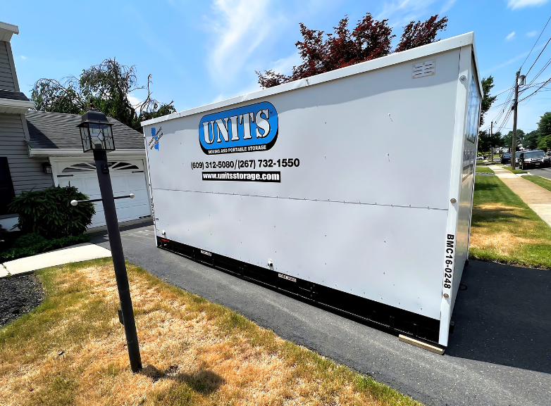 UNITS of Bucks Mercer County's portable storage container parked on a driveway.