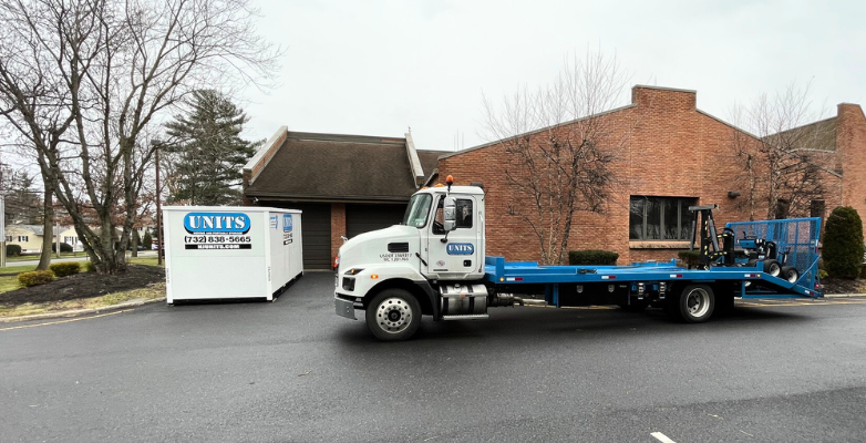 UNITS of Bucks Mercer County Portable Storage container and delivery truck parked outside of a police station in NJ.