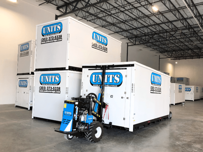 ROBO-UNIT moving a UNITS Moving and Portable Storage container in a warehouse.