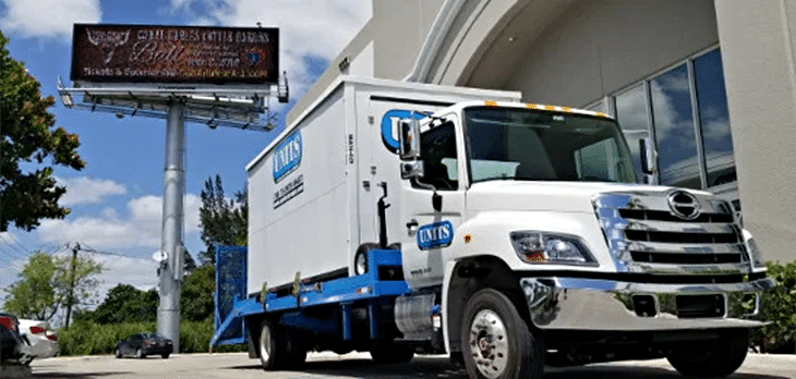 Truck with a UNITS Moving and Portable Storage of Cincinnati container in front of a business.