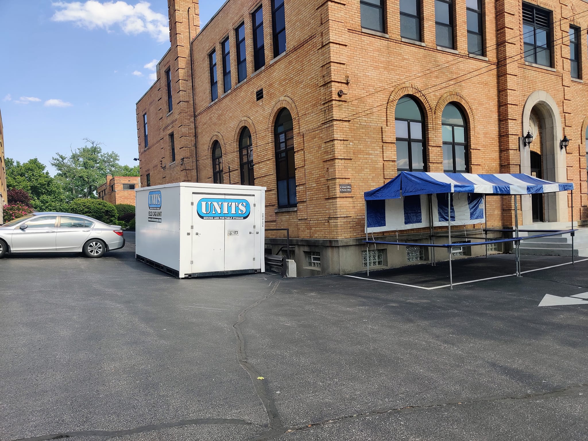 UNITS Moving and Portable Storage of Cincinnati container outside behind a building.