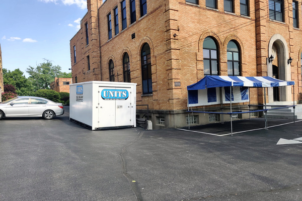 UNITS Moving and Portable Storage of Cincinnati container outside behind a building.