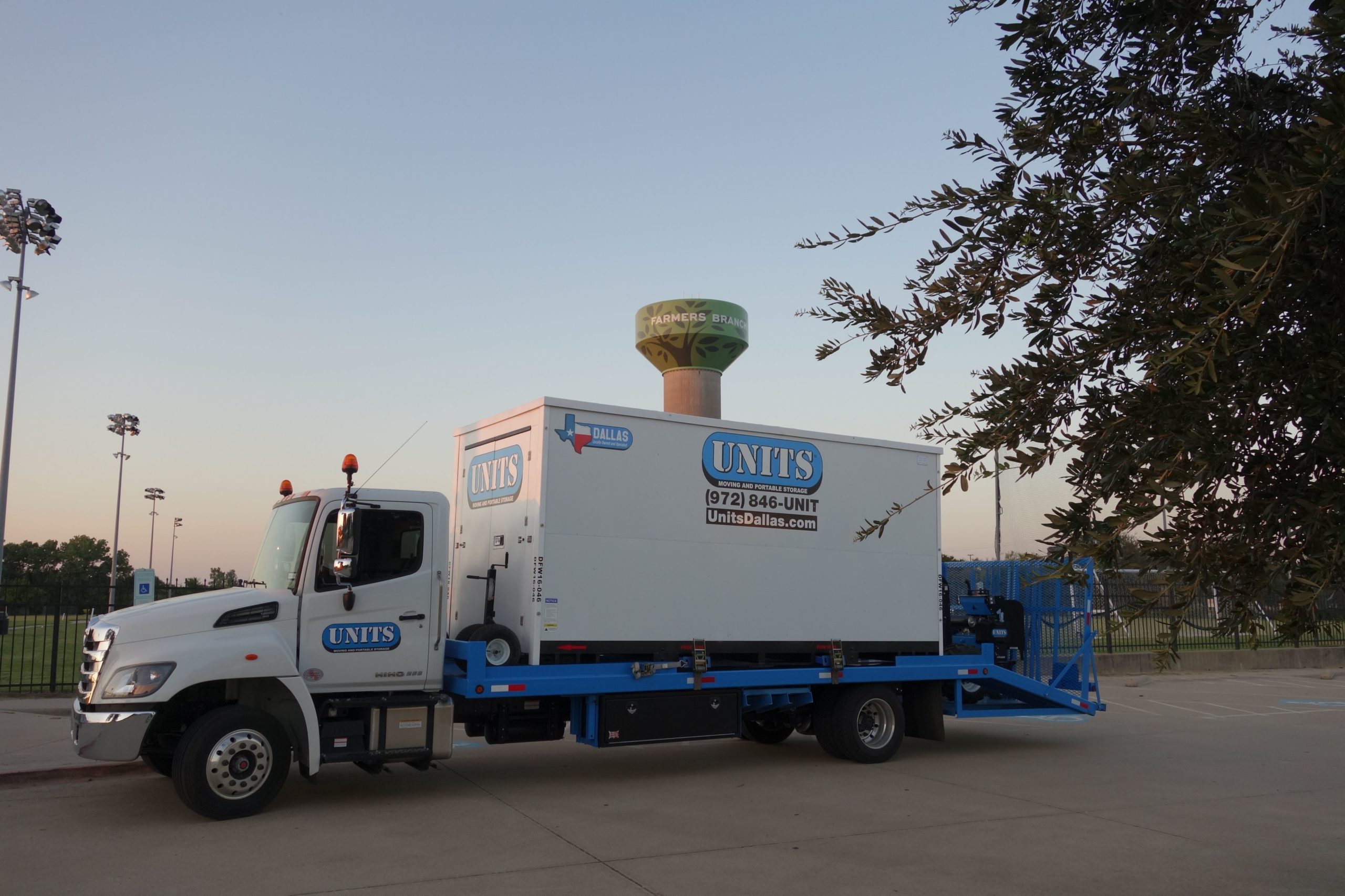 UNITS truck delivering container