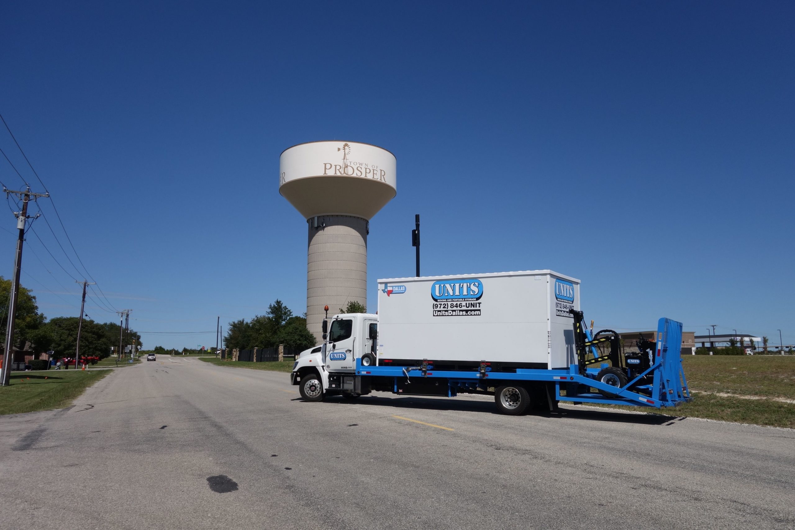 UNITS truck delivering container