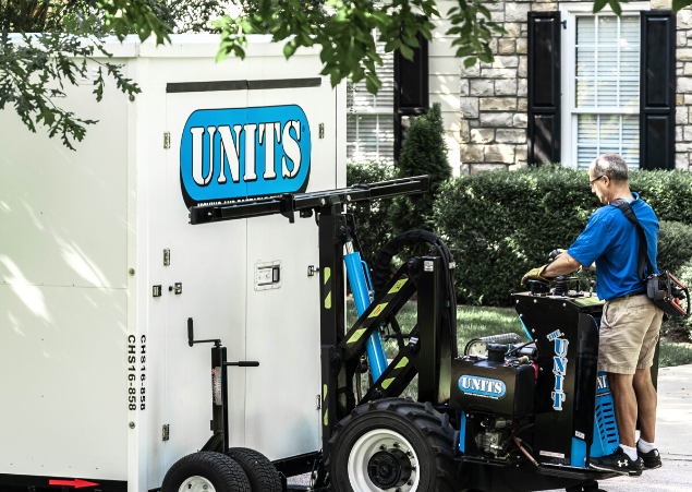 Man using a ROBO-UNIT to move a UNITS Moving and Portable Storage container.