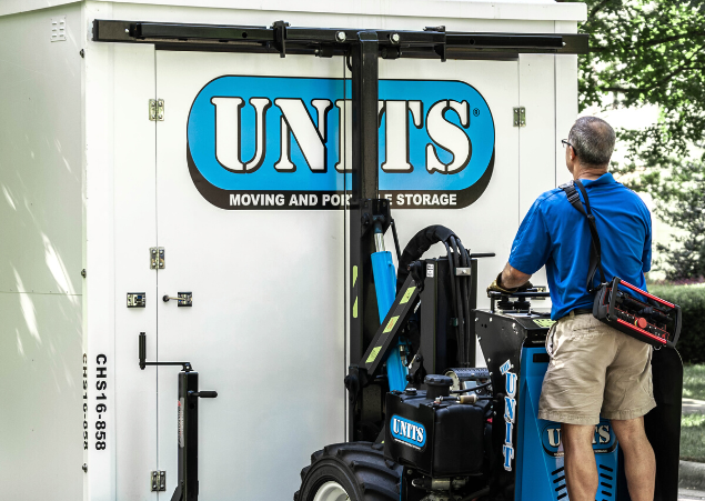 Man using a ROBO-UNIT to move a UNITS Moving and Portable Storage container.