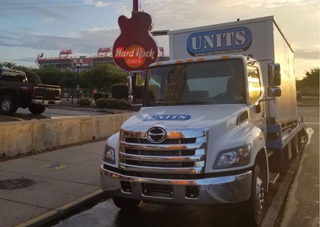 UNITS Moving and Portable Storage truck in front of a Hard Rock Cafe.