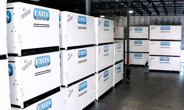 Units of Houston Gulf Coast containers stacked in a warehouse.