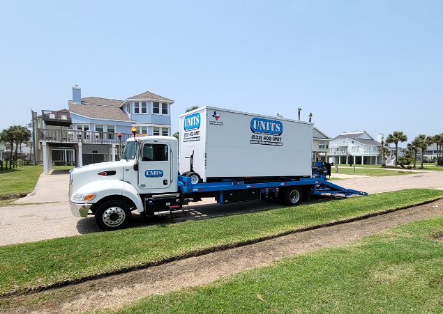 A Units of Houston Gulf Coast truck parked in the street.