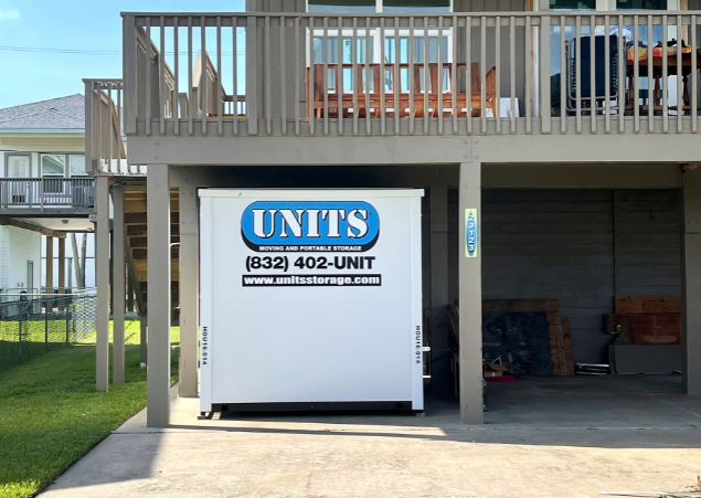 A Units of Houston Gulf Coast container sitting under a porch.