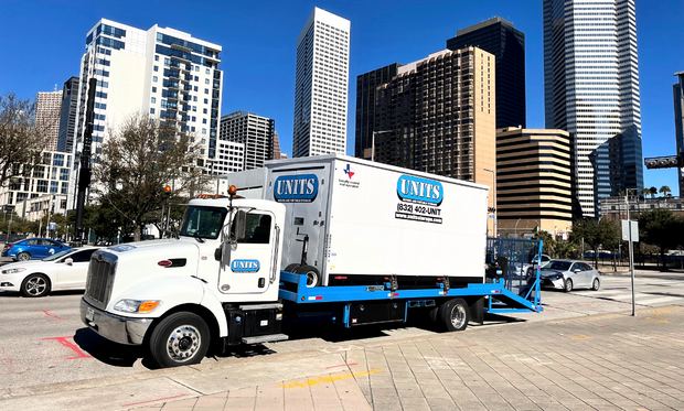 A Units of Houston Gulf Coast truck parked on the street.