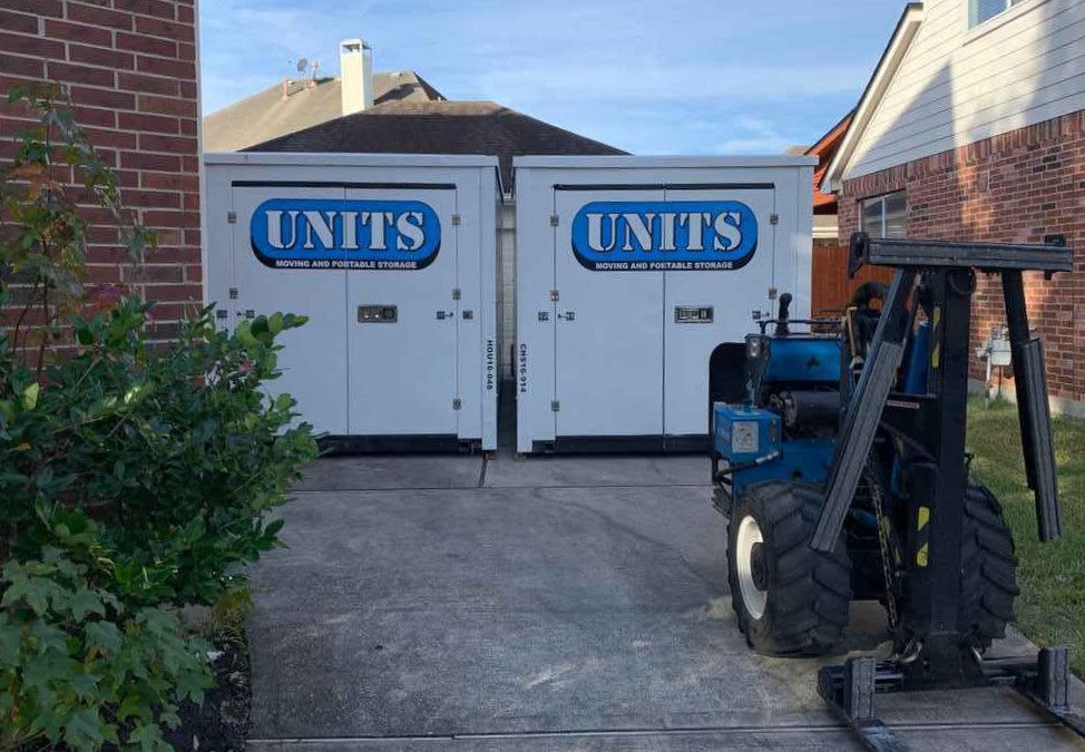 Two Units of Houston Gulf Coast containers sitting in a driveway.