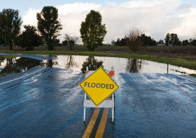 A road thats has been blocked off due to flooding.