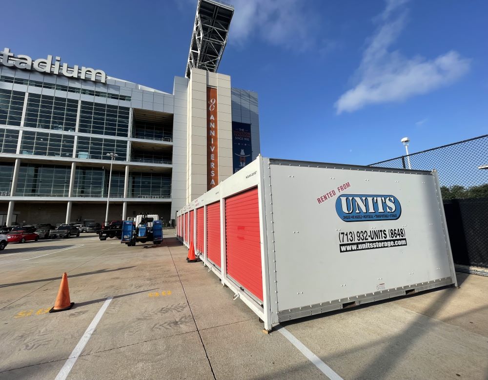 UNITS Moving and Portable Storage containers in a stadium parking lot.