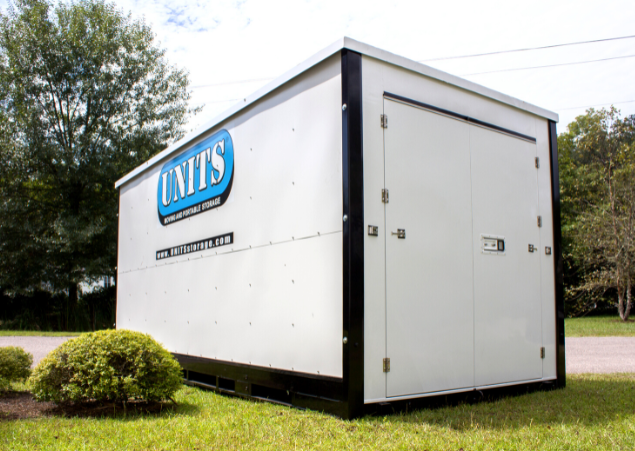 UNITS Moving and Portable Storage container in a front yard.