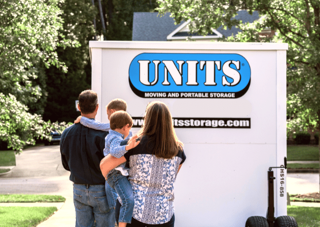 Family outside of their UNITS storage container