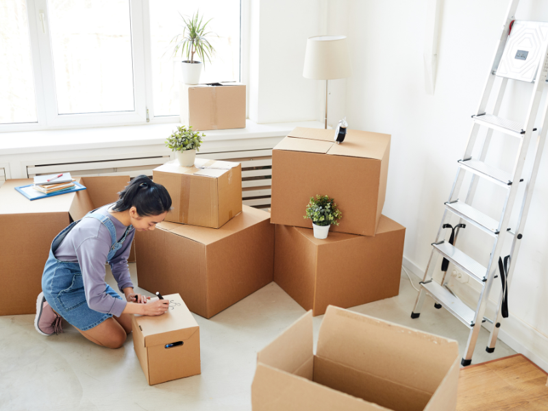 Woman who is beginning to Pack Efficiently for a Move