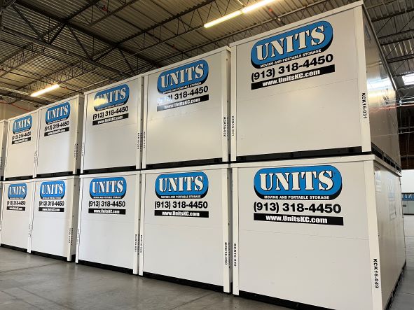 Units of Kansas City containers stacked in a warehouse.