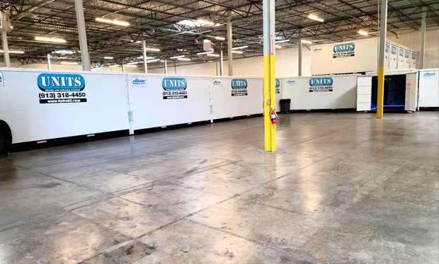 Units of Kansas City containers stacked in a warehouse.