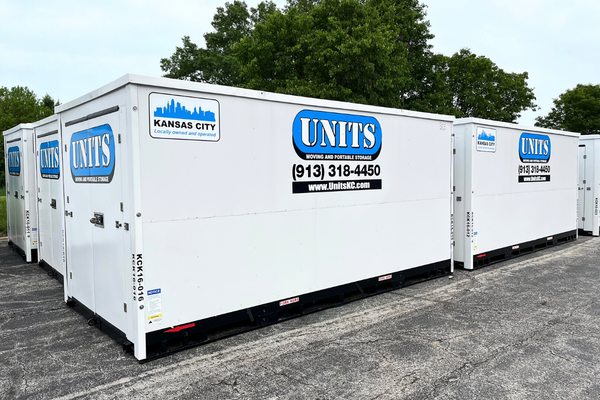 Units of Kansas City containers sitting in a parking lot.