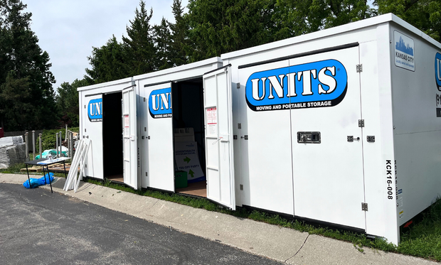 Three Units of Kansas City containers and two of them have a door open.