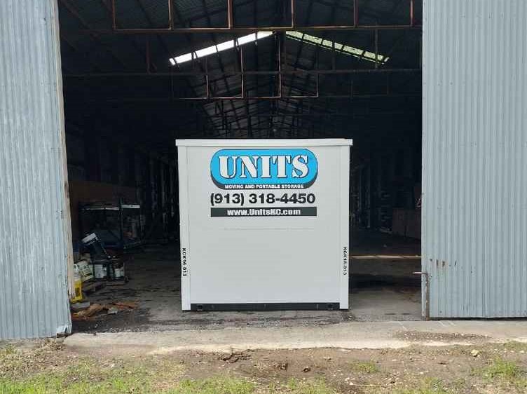 A Units of Kansas City container sitting in a warehouse.