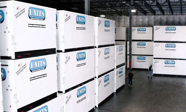 Units Of Lexington Kentucky containers stacked in a warehouse.