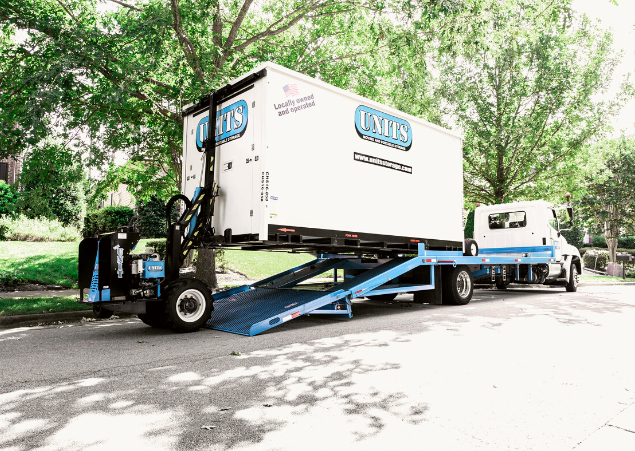 A Units Of Lexington Kentucky container getting loaded onto a truck.