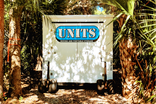 UNITS Moving and Portable Storage Container sitting between trees.