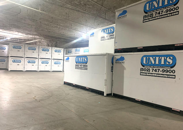 Units Of Louisville containers stacked in a warehouse.