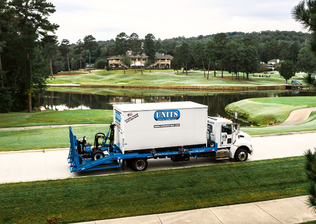 A Units Of Louisville parked on the side of a golf course.