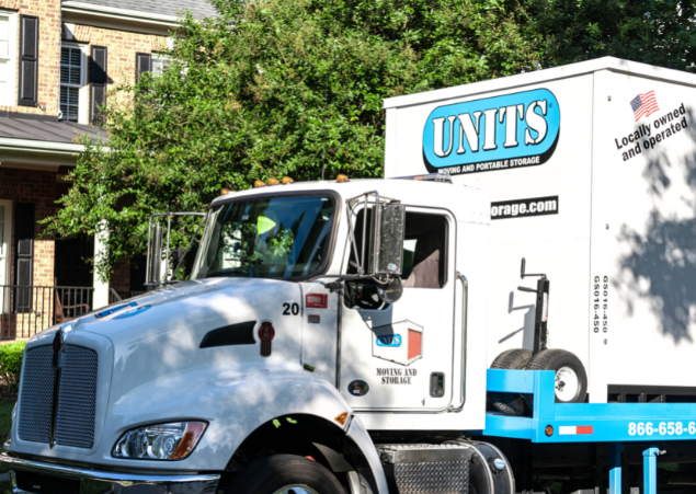 A Units Of Louisville truck parked in front of a house.