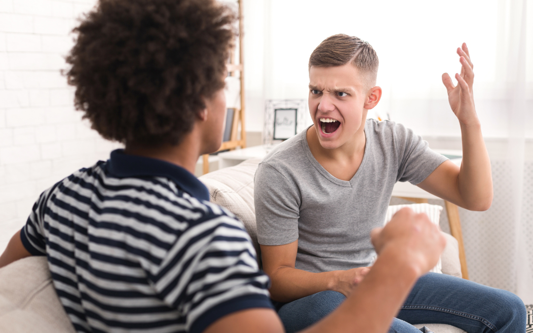 A couple arguing on the couch.