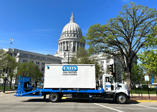 Madison capitol with a UNIT container outside of it.