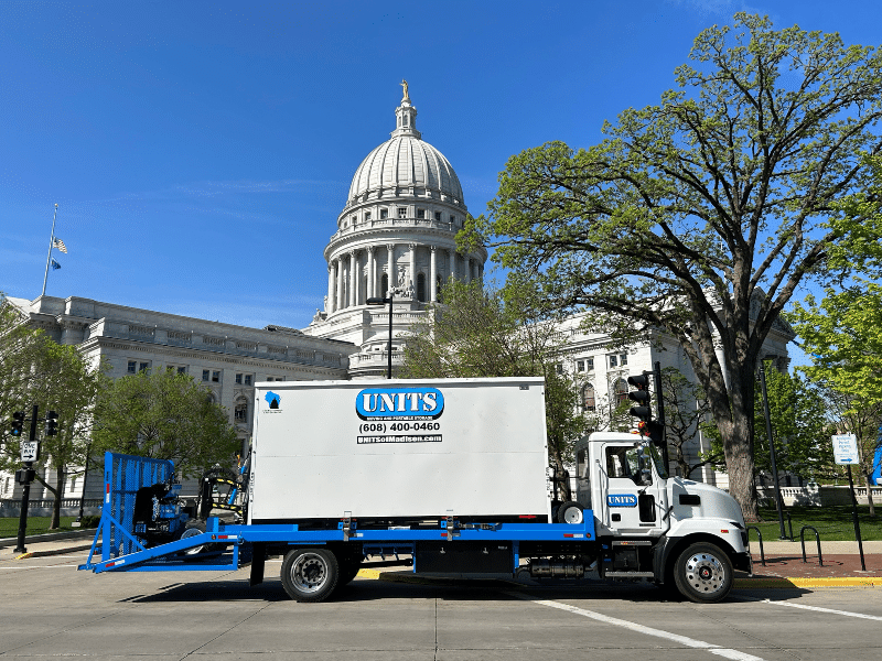 Madison capitol with a UNIT container outside of it.