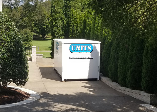 A Units Of Memphis a container sitting in a driveway.