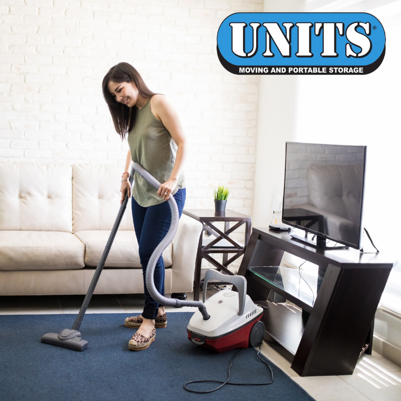 Woman vacuuming her living room.