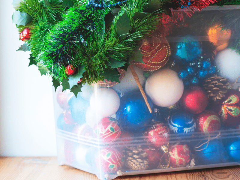 Holdiay decorations in a plastic container.