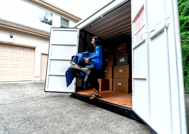 Units of Minneapolis woman unpacking items from container