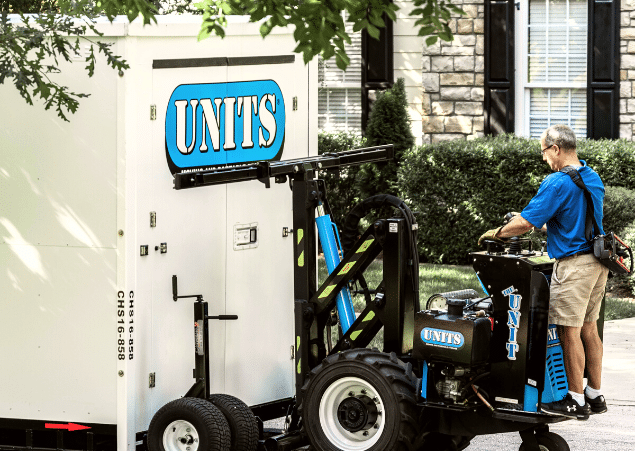 Units of Minneapolis man loading units container off of truck