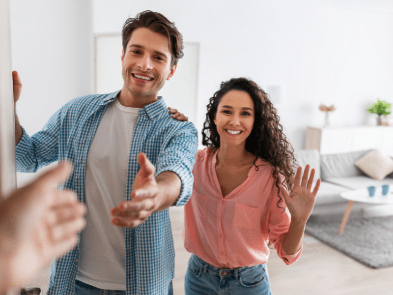 Units of Minneapolis man reaching out to shake another persons hand