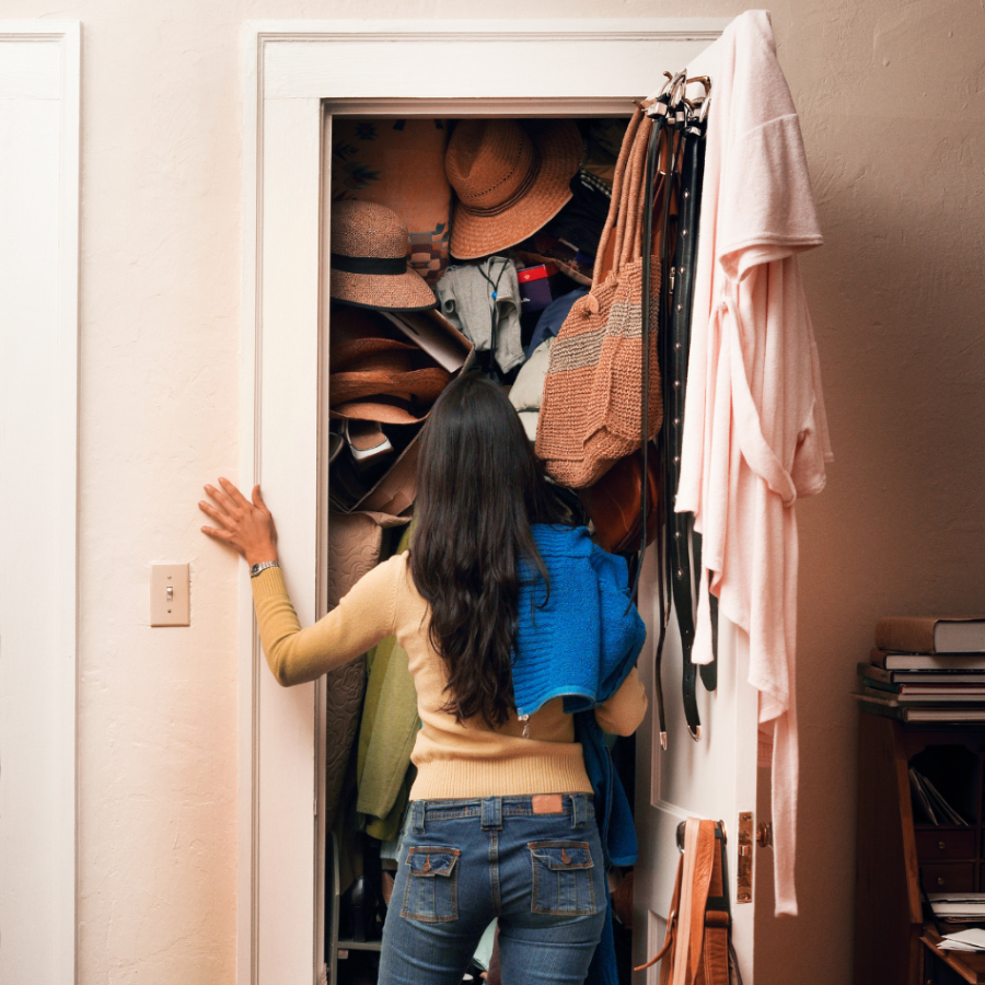 Units of North Denver woman looking at cluttered closet