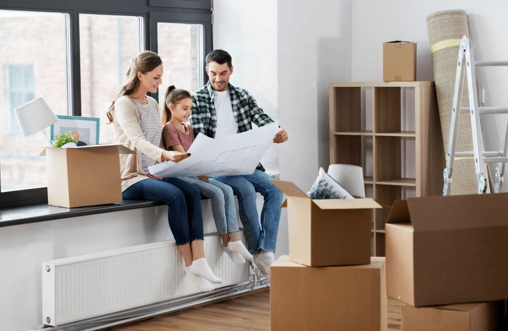 Units of North Denver family sitting looking at floor plans