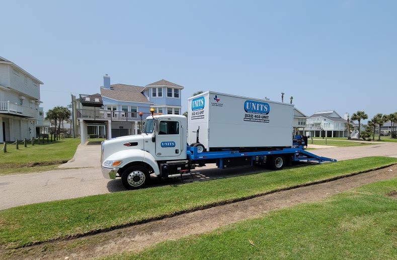 Units of North Houston truck sitting in front of house