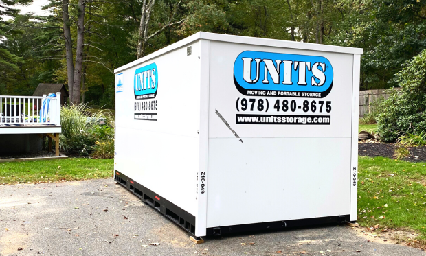 A Units of North Shore container sitting in a driveway.