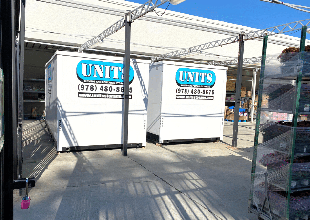 Two Units of North Shore containers sitting outside.